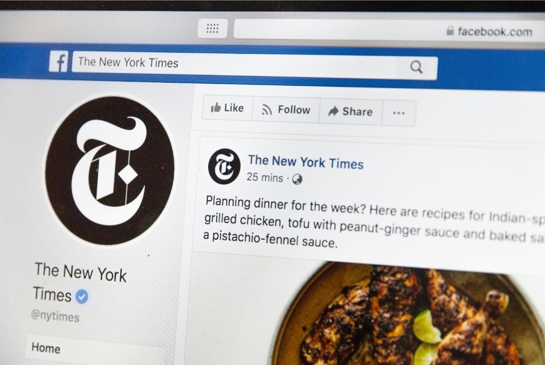 The New York Times Facebook page taken by a phone camera looking at a computer screen.