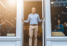 Five Smart Ways to Boost Your Website ROI in 2025 Small business owner welcoming customers.