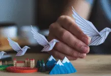 How to Create Ads That Connect with People Everywhere Paper bird flying over global landscapes.